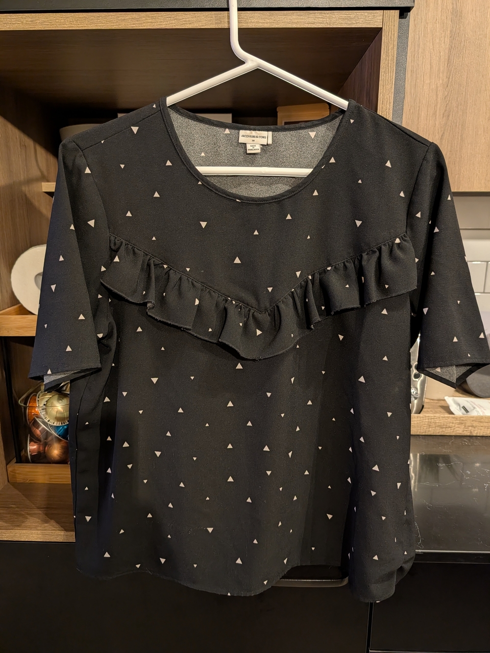 Ruffle Front Short Sleeve Blouse in Black with Triangle Print